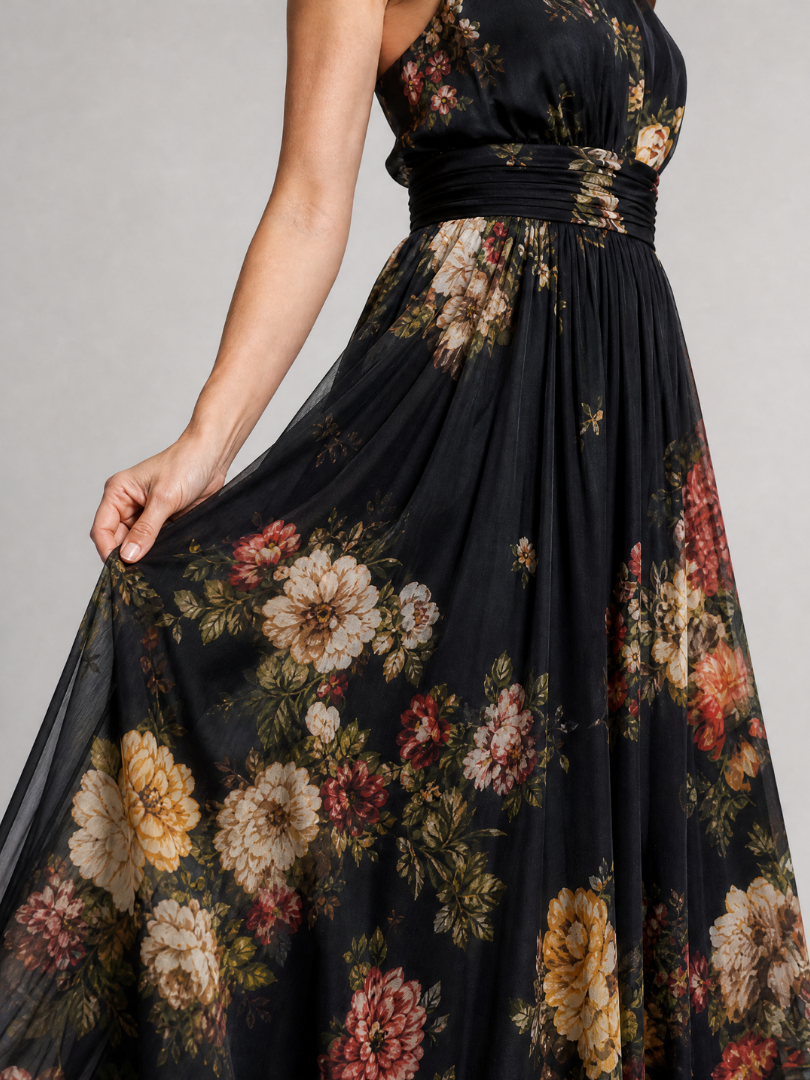 Floral midi dress featuring a defined waist and halter neck, designed for summer weddings, made from lightweight, flowing fabric. 1
