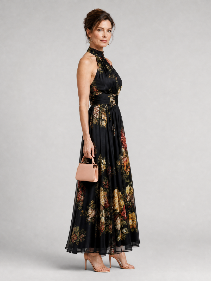 Floral midi dress featuring a defined waist and halter neck, designed for summer weddings, made from lightweight, flowing fabric. 3