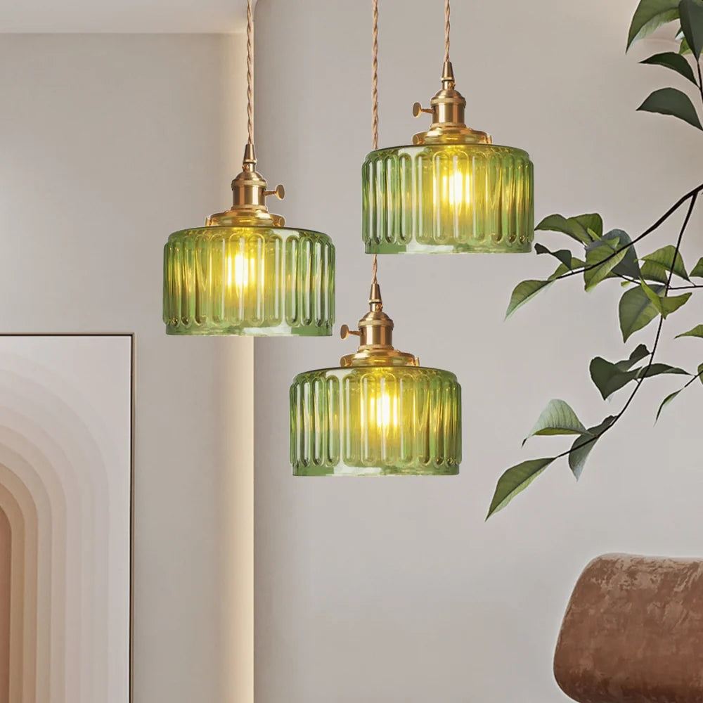 Vintage green glass pendant light with adjustable hanging feature, perfect for kitchen and dining areas, showcasing a stylish design that enhances home decor. 1