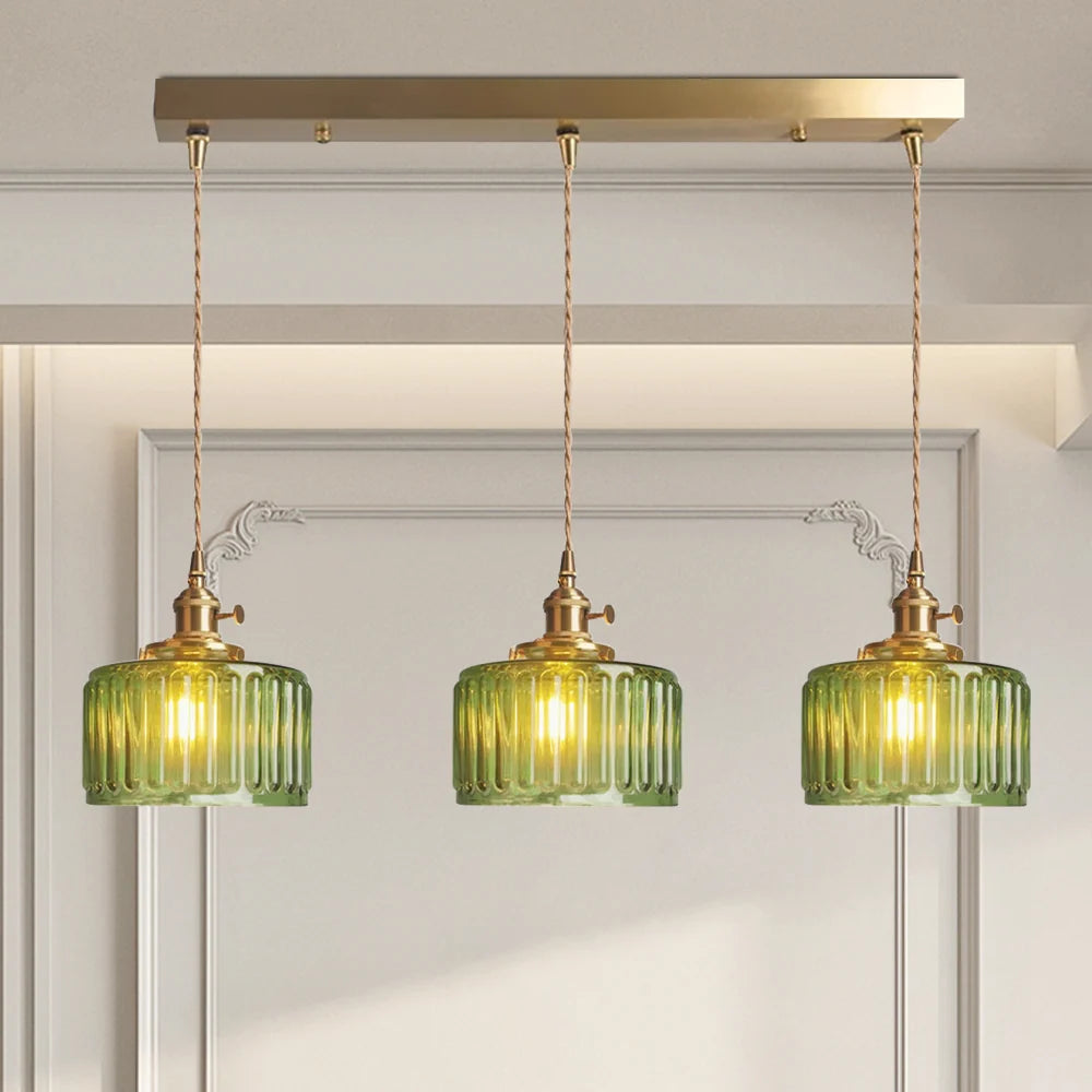 Vintage green glass pendant light with adjustable hanging feature, perfect for kitchen and dining areas, showcasing a stylish design that enhances home decor. 2
