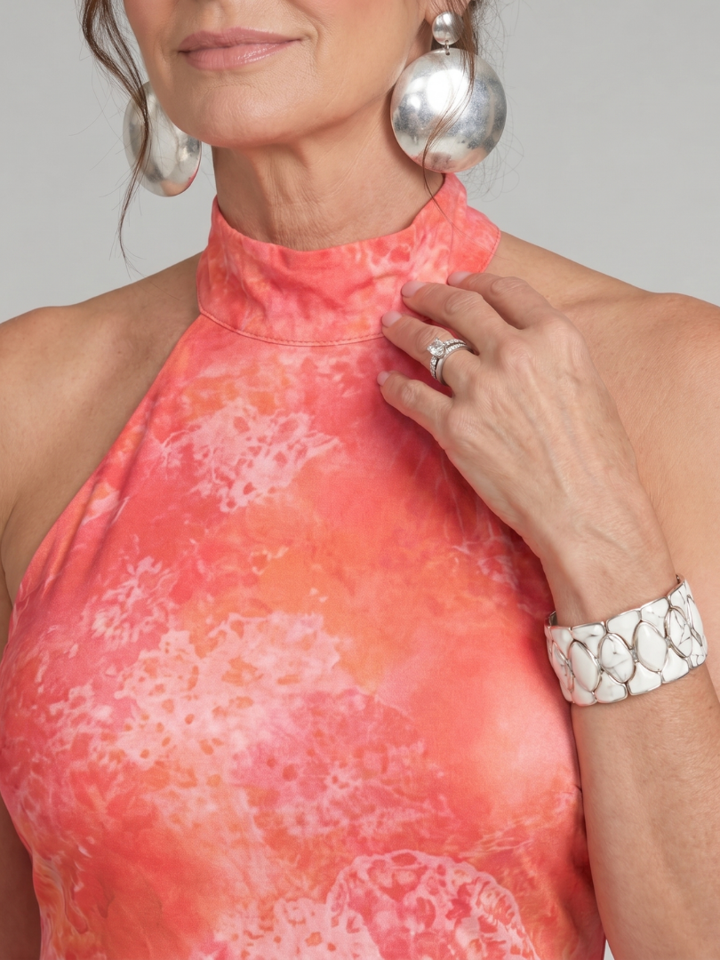 Halter neck maxi dress featuring a vibrant printed pattern, designed for elegance with a lightweight sleeveless style, perfect for special occasions. 2
