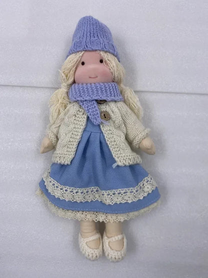 Handcrafted Waldorf doll made from soft fabric and sustainable materials, featuring a washable design, perfect eco-friendly toy for kids. 0