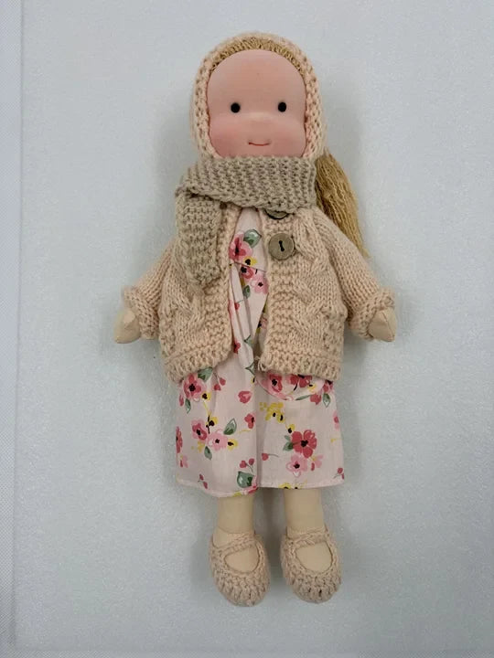 Handcrafted Waldorf doll made from soft fabric and sustainable materials, featuring a washable design, perfect eco-friendly toy for kids. 2