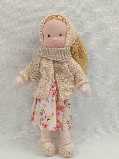 Handcrafted Waldorf doll made from soft fabric and sustainable materials, featuring a washable design, perfect eco-friendly toy for kids. 3