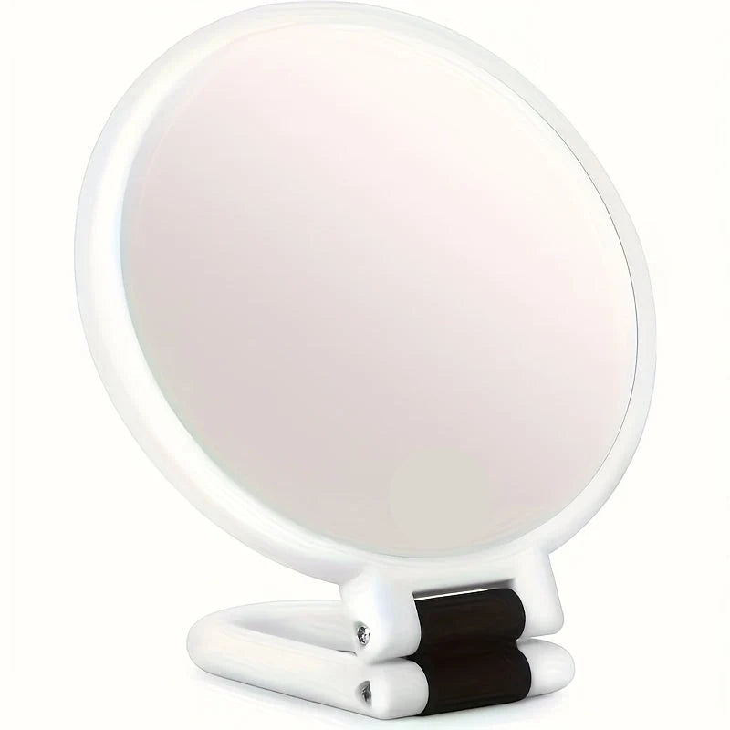 Handheld makeup mirror featuring 30X/40X magnification and a 360-degree folding handle, designed in a sleek black and white plastic finish 0