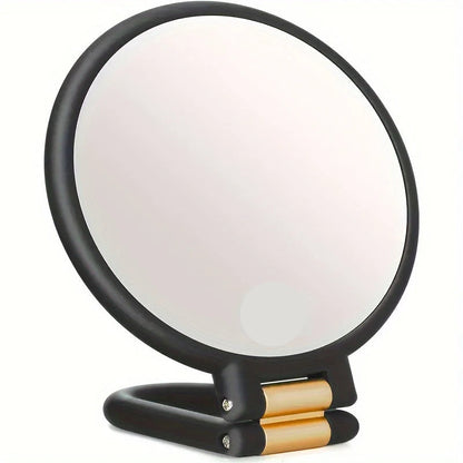 Handheld makeup mirror featuring 30X/40X magnification and a 360-degree folding handle, designed in a sleek black and white plastic finish 1