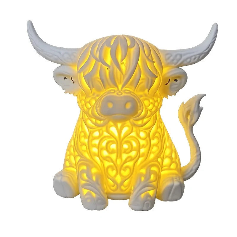 Highland Cow Table Lamp featuring a warm LED glow and intricate filigree design, perfect for adding charm to your bedroom or desk, powered by USB 1