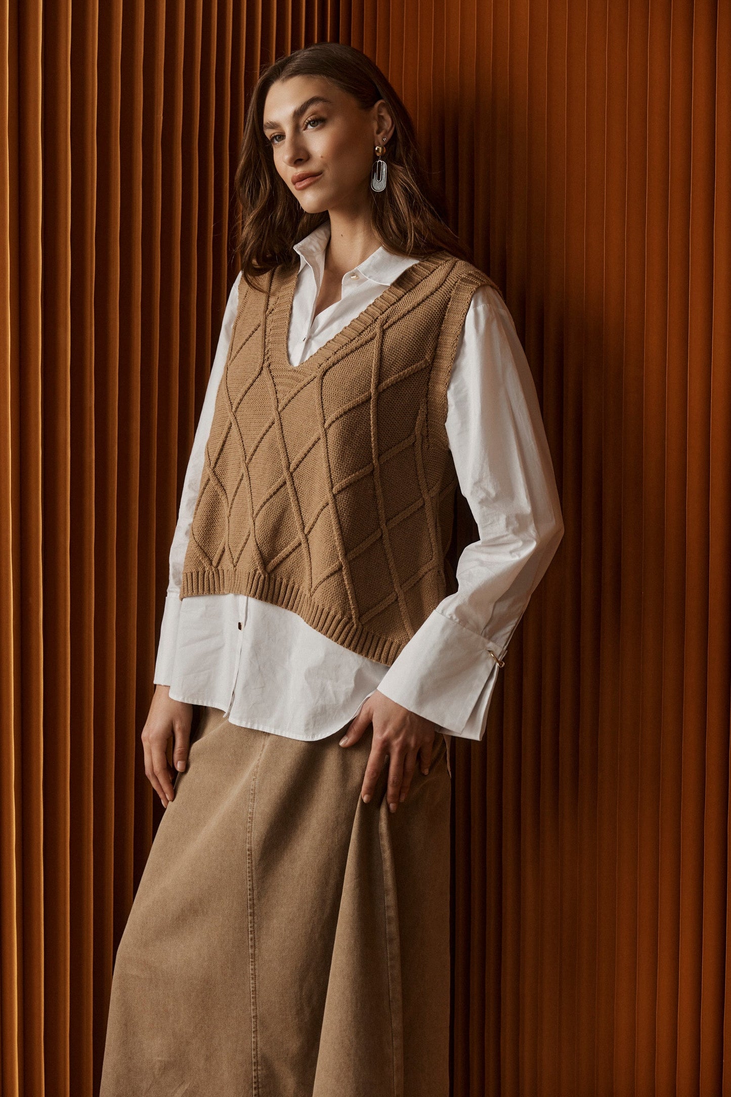 Knitted vest for women featuring a V-neck and checkerboard pattern, made from breathable cotton in a stylish mocha color, perfect for layering. 0