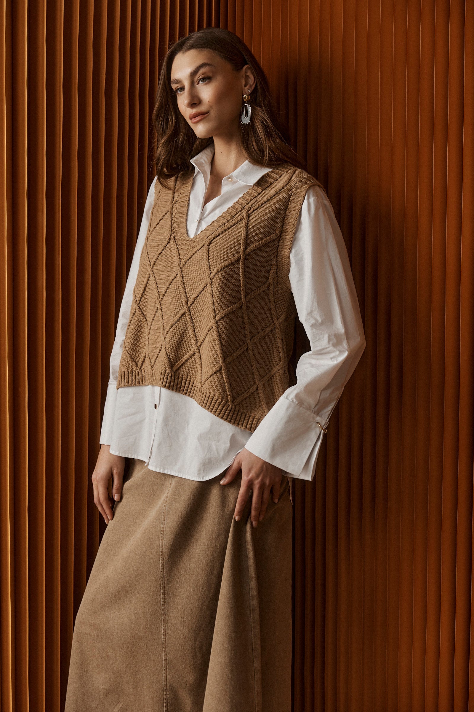 Knitted vest for women featuring a V-neck and checkerboard pattern, made from breathable cotton in a stylish mocha color, perfect for layering. 0
