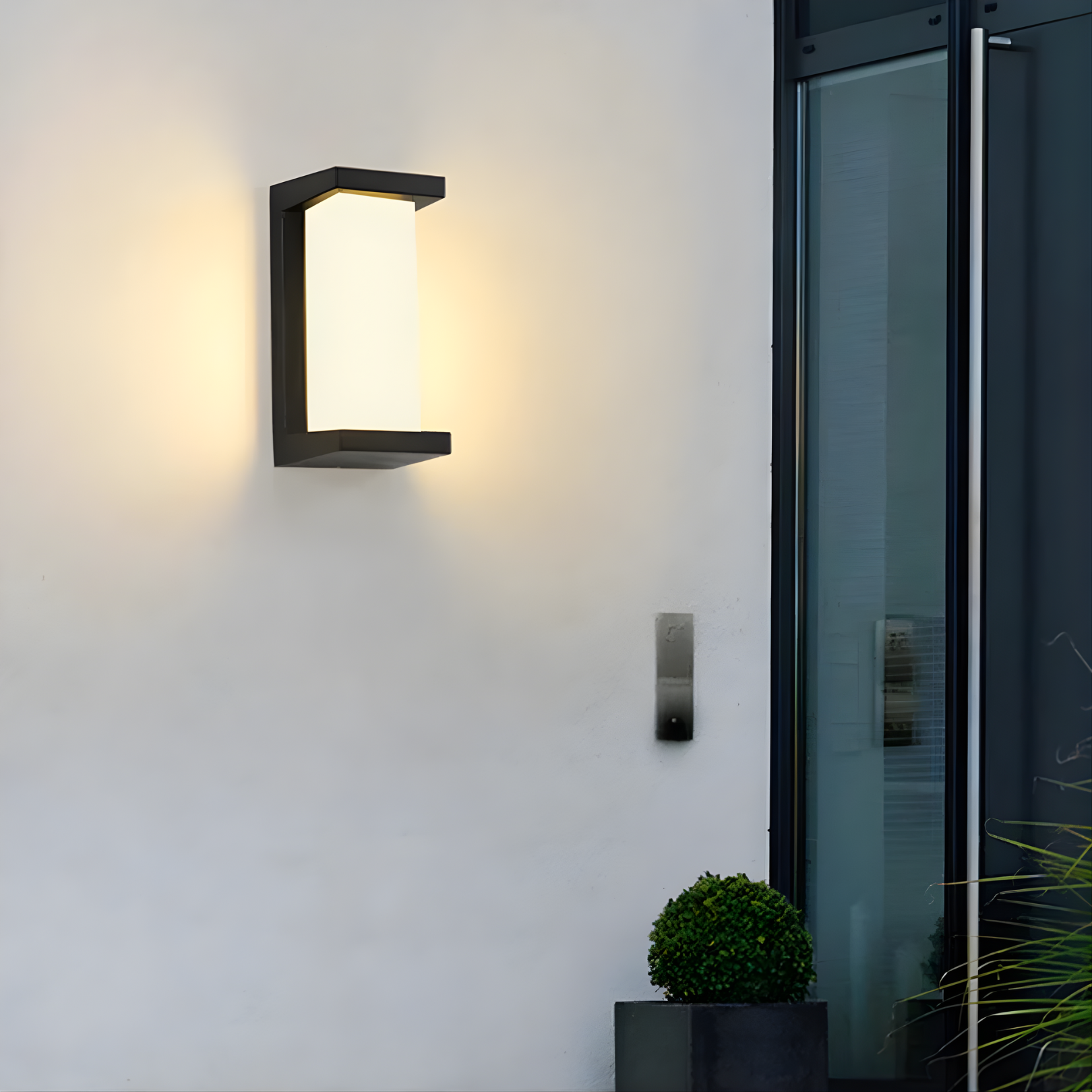 LED outdoor wall light featuring a motion sensor, designed for durability with IP65 weatherproof rating, emitting warm white light for enhanced security and ambiance. 3