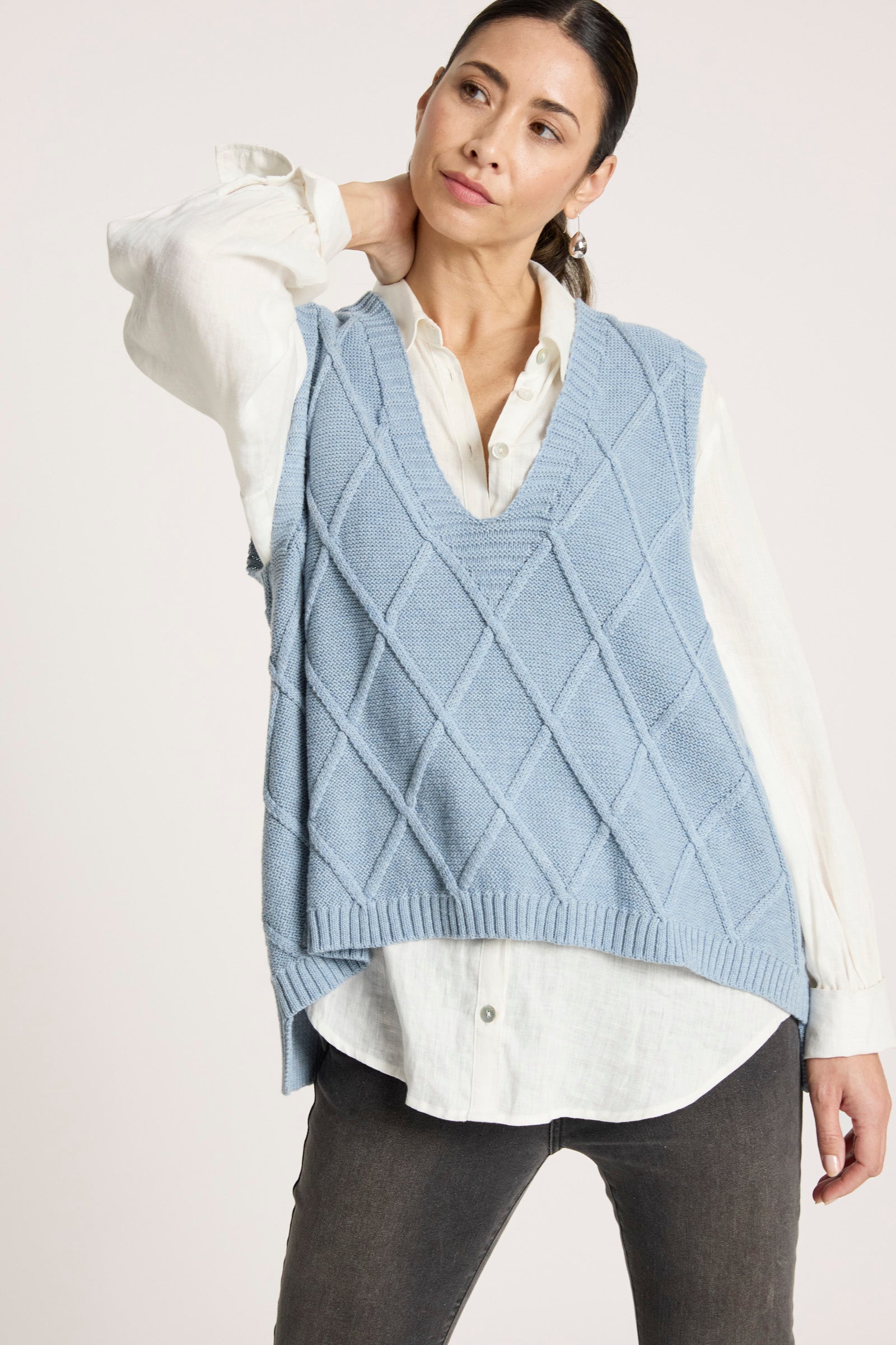 Ladies knitted vest featuring a stylish checkerboard pattern, crafted from breathable cotton with a V-neck design, perfect for layering in any season. 4