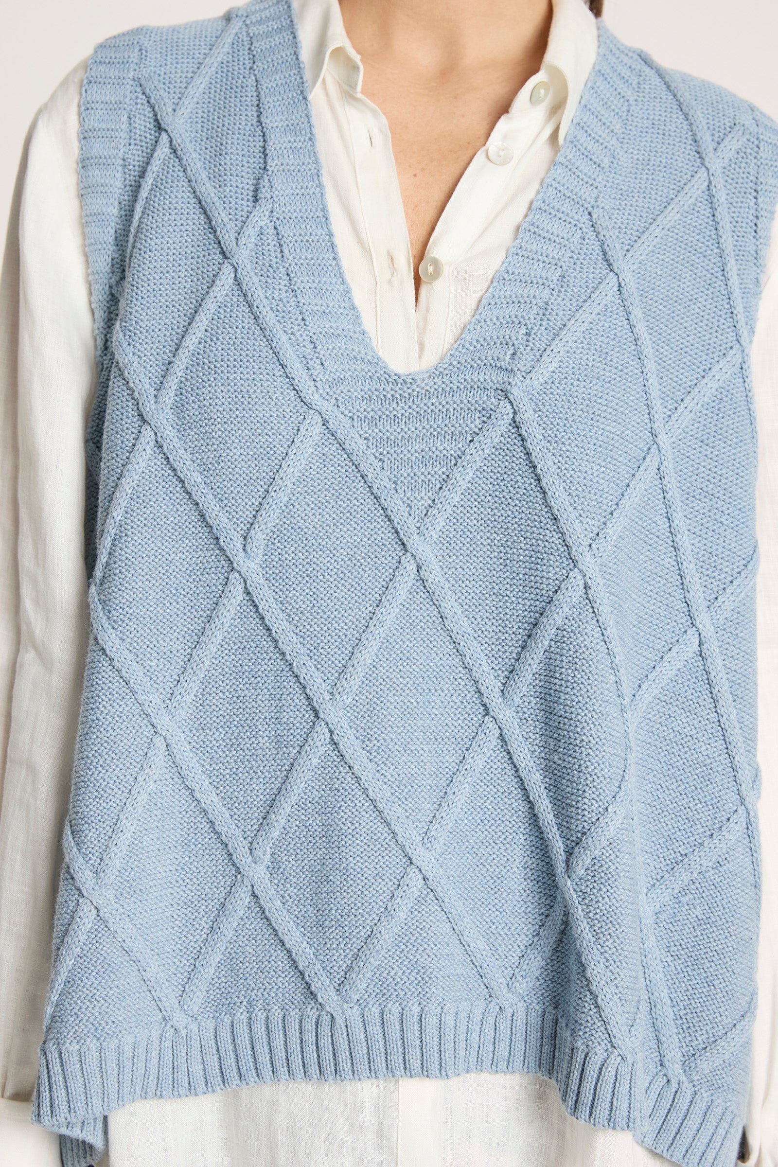 Ladies knitted vest featuring a stylish checkerboard pattern, crafted from breathable cotton with a V-neck design, perfect for layering in any season. 5
