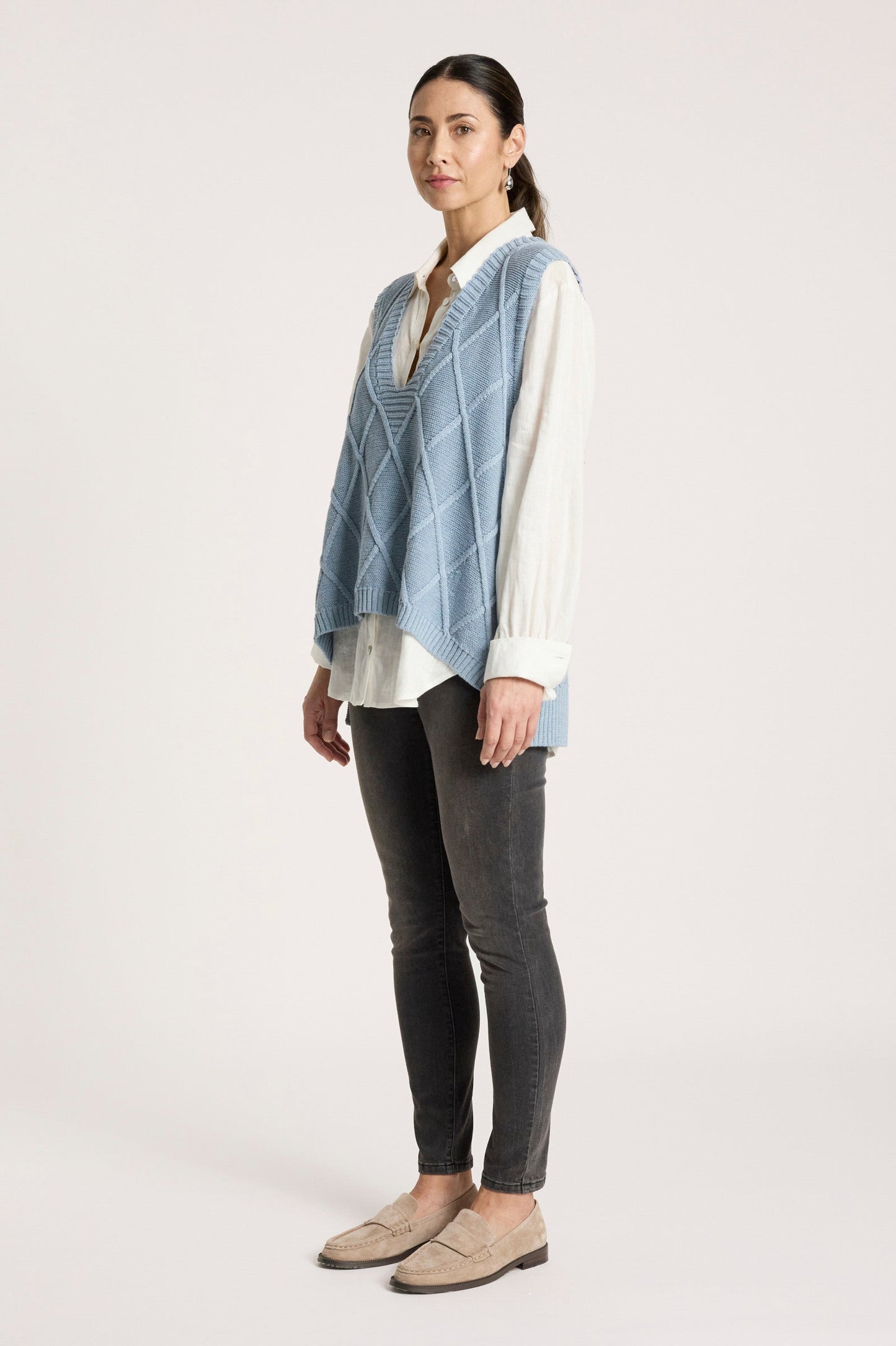 Ladies knitted vest featuring a stylish checkerboard pattern, crafted from breathable cotton with a V-neck design, perfect for layering in any season. 6