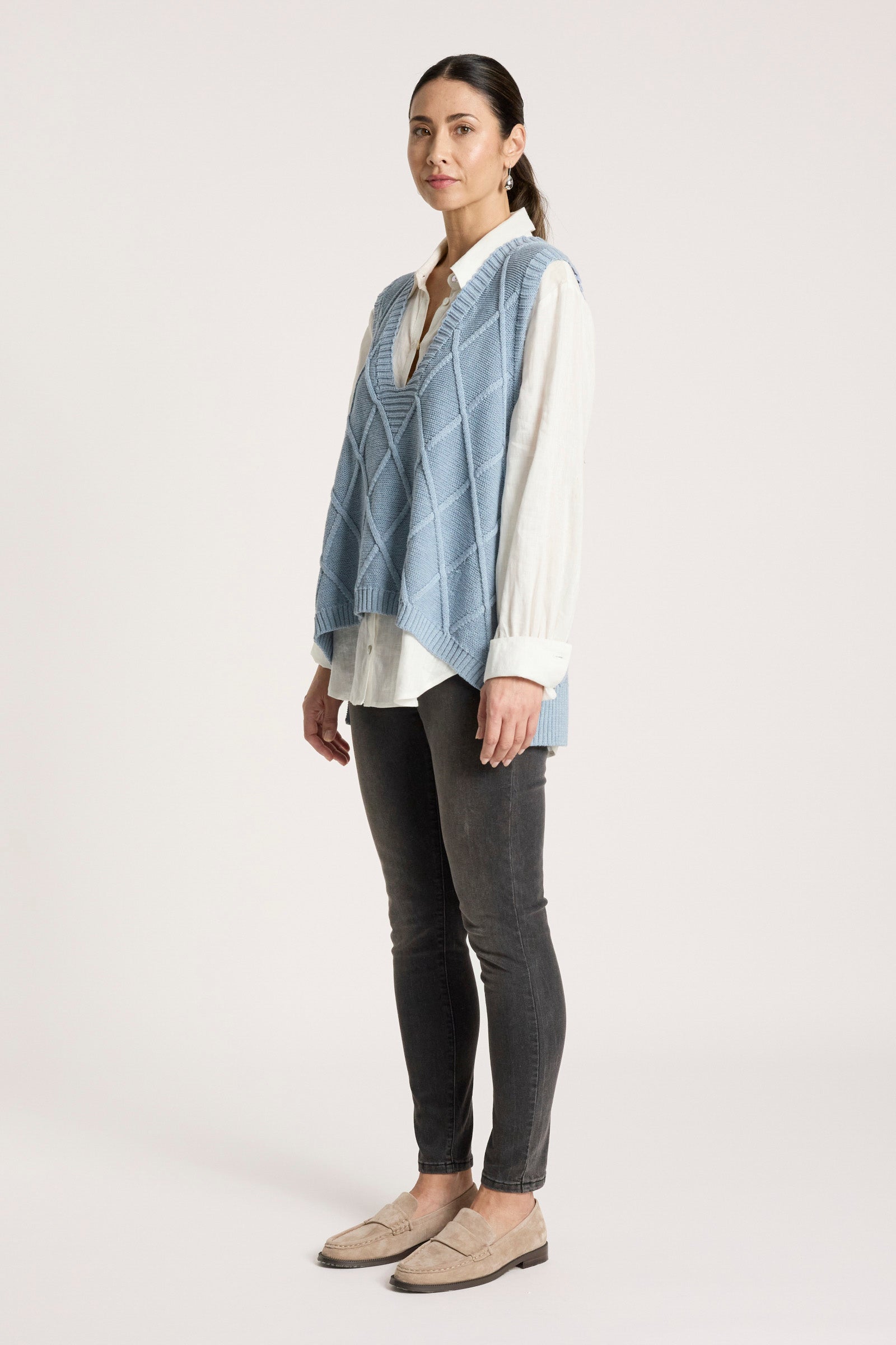 Ladies knitted vest featuring a stylish checkerboard pattern, crafted from breathable cotton with a V-neck design, perfect for layering in any season. 6