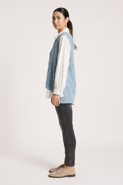 Ladies knitted vest featuring a stylish checkerboard pattern, crafted from breathable cotton with a V-neck design, perfect for layering in any season. 7