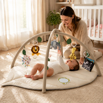 Leaf-shaped baby play gym featuring colorful detachable toys, designed for tummy time with a soft padded mat suitable for newborns and infants. 1