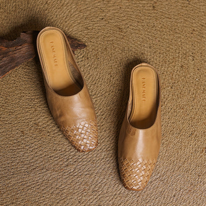 Black leather mules featuring a cushioned insole and woven finish, designed with a square-toe heel for stylish comfort. 5