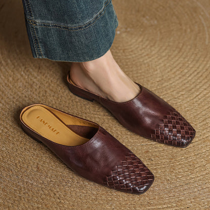 Black leather mules featuring a cushioned insole and woven finish, designed with a square-toe heel for stylish comfort. 8