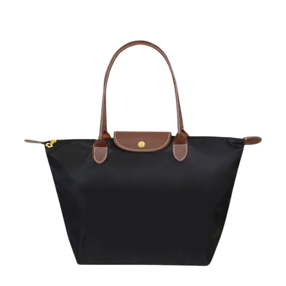 Leather tote bag featuring water-resistant material and a spacious design, perfect for stylish everyday use. 0