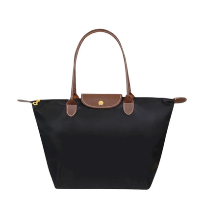 Leather tote bag featuring water-resistant material and a spacious design, perfect for stylish everyday use. 0