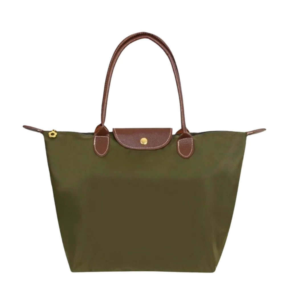 Leather tote bag featuring water-resistant material and a spacious design, perfect for stylish everyday use. 1