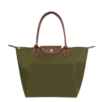 Leather tote bag featuring water-resistant material and a spacious design, perfect for stylish everyday use. 1