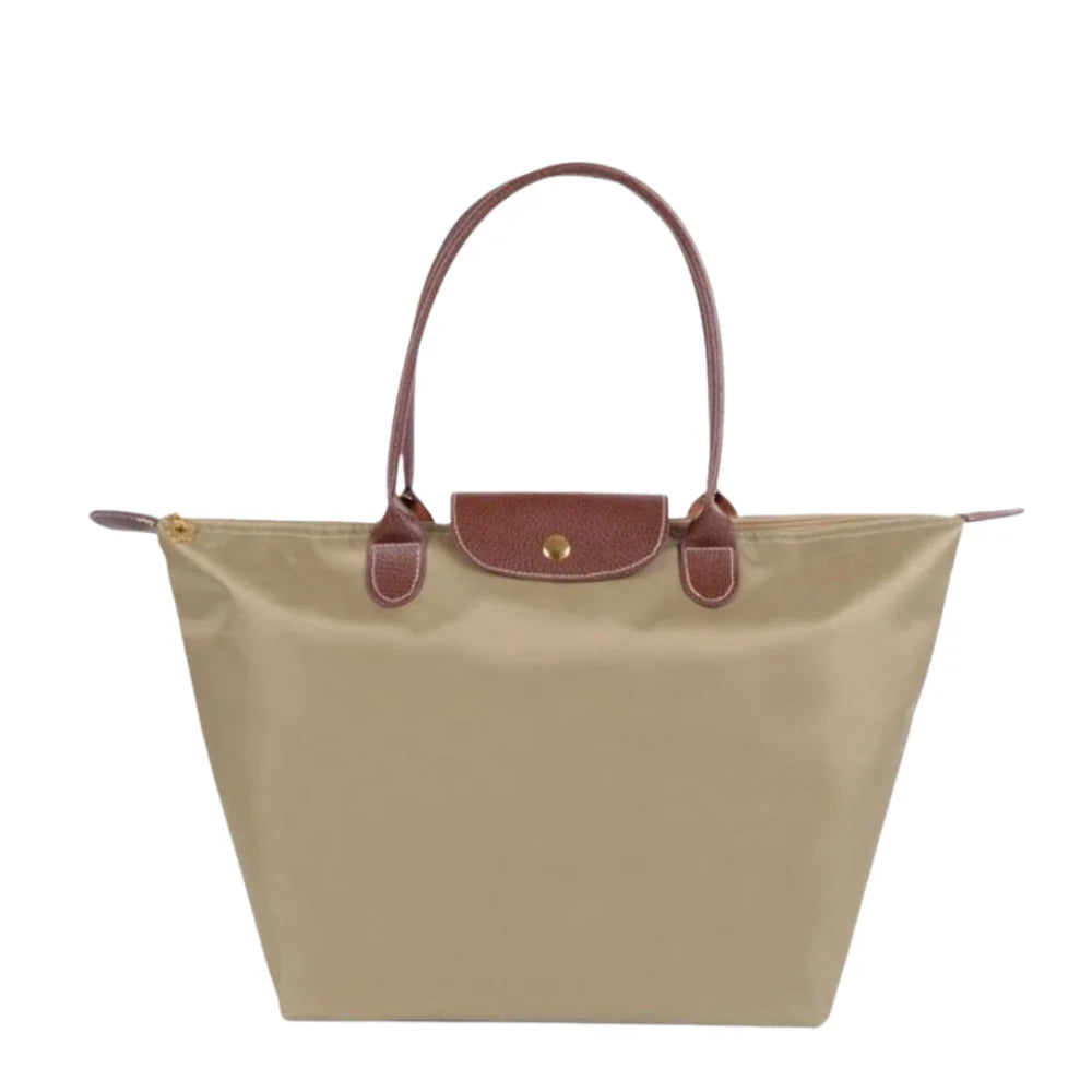 Leather tote bag featuring water-resistant material and a spacious design, perfect for stylish everyday use. 2