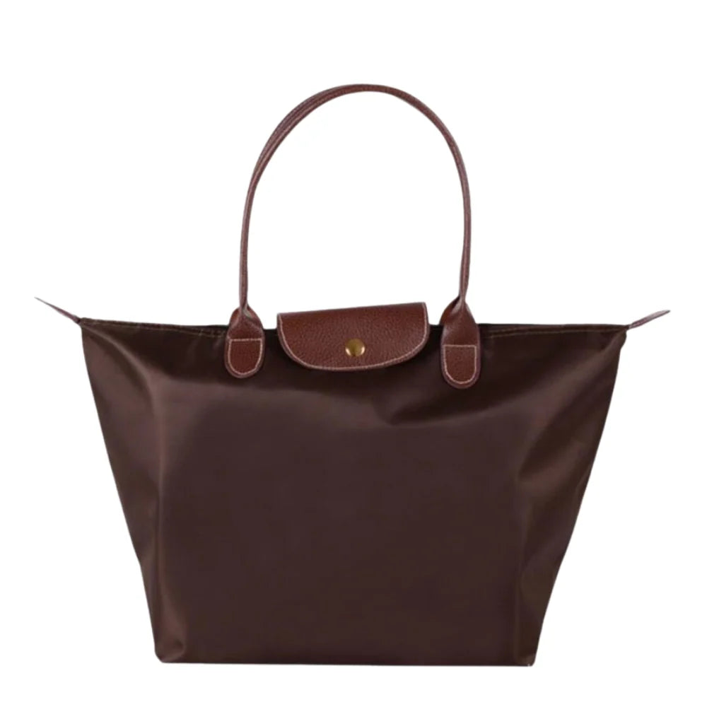 Leather tote bag featuring water-resistant material and a spacious design, perfect for stylish everyday use. 3