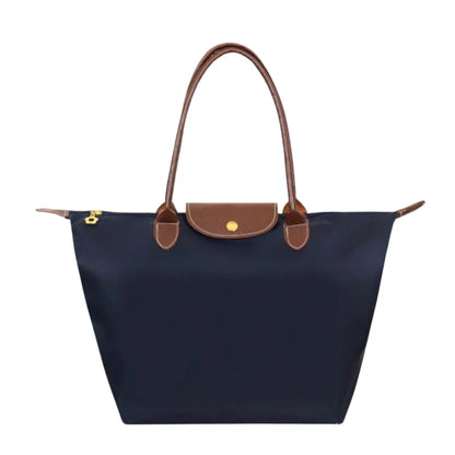 Leather tote bag featuring water-resistant material and a spacious design, perfect for stylish everyday use. 4
