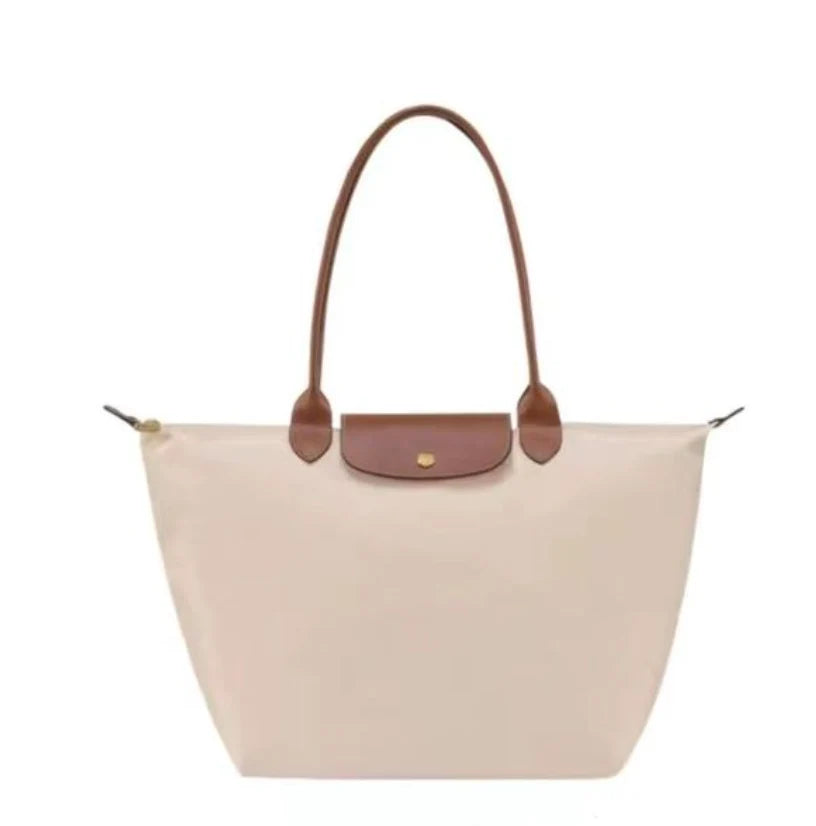 Leather tote bag featuring water-resistant material and a spacious design, perfect for stylish everyday use. 5