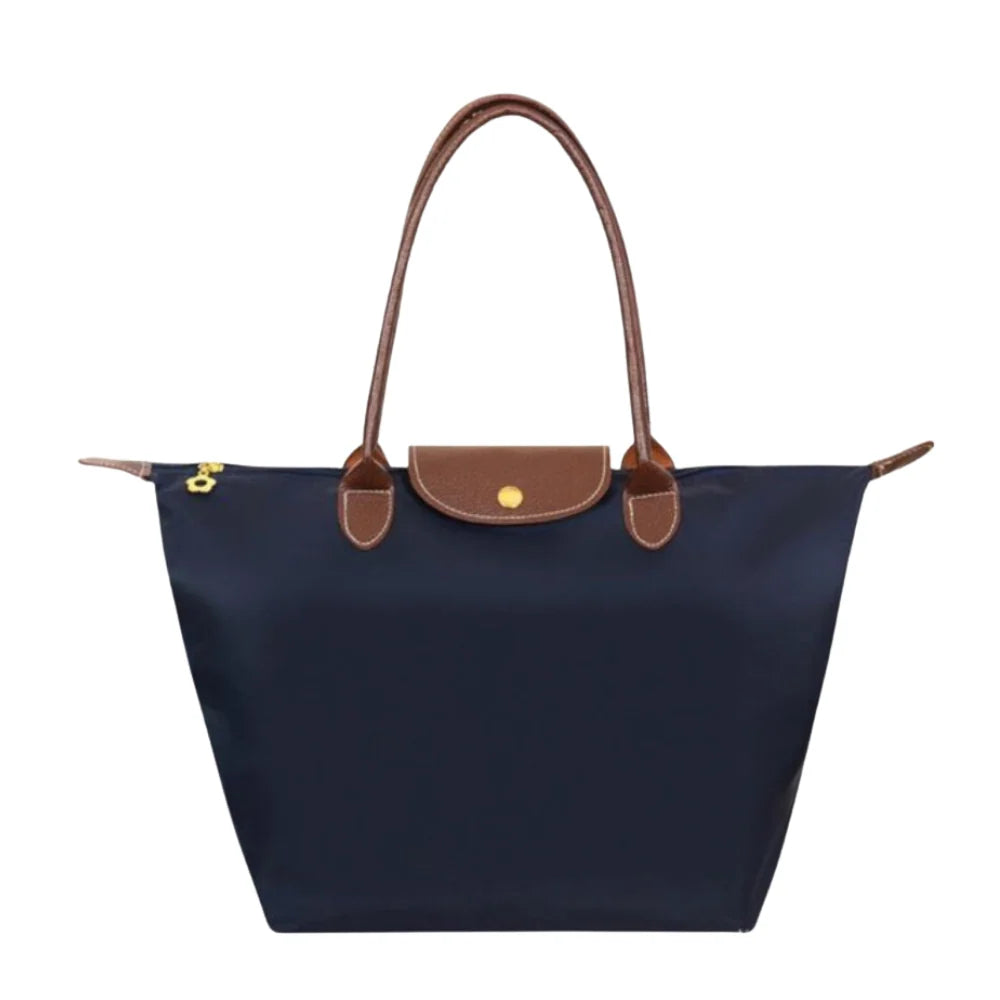 Leather tote bag featuring water-resistant material and a spacious design, perfect for stylish everyday use. 6