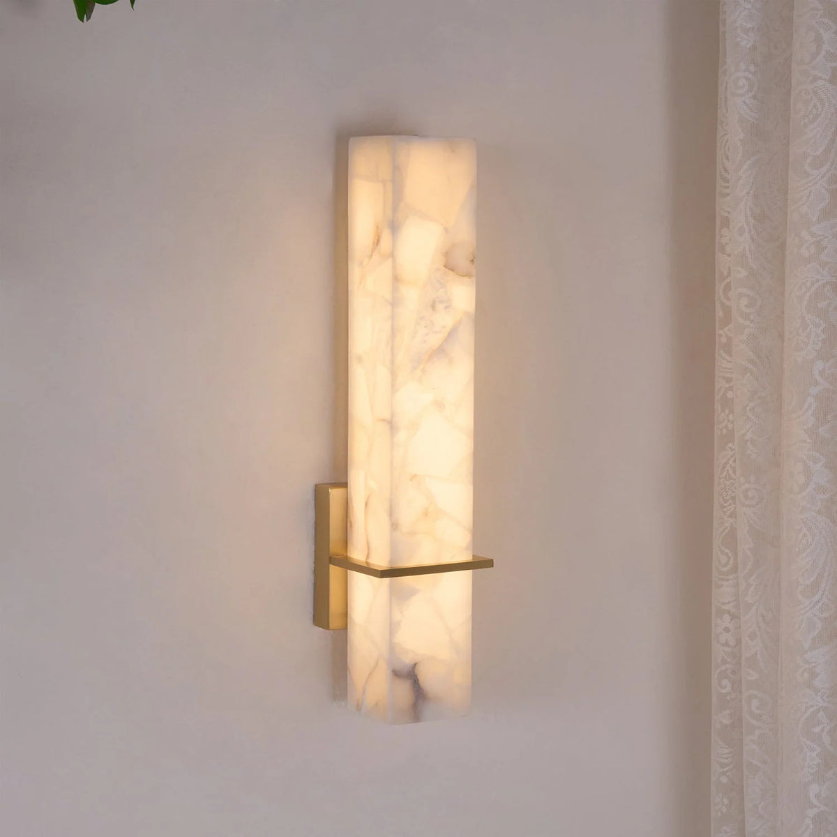 Modern linear wall light featuring an elegant alabaster diffuser, available in dimmable brass or nickel finish, designed to enhance ambient lighting in contemporary interiors. 3