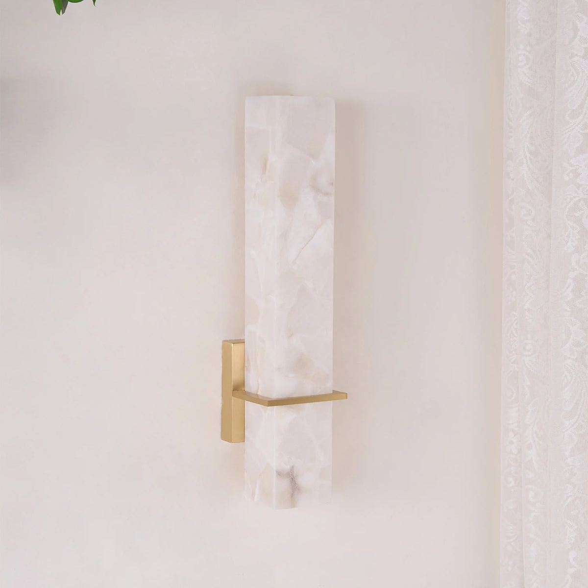 Modern linear wall light featuring an elegant alabaster diffuser, available in dimmable brass or nickel finish, designed to enhance ambient lighting in contemporary interiors. 7