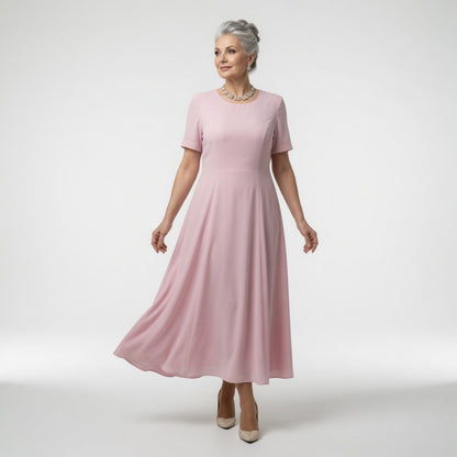 Long formal dress featuring intricate floral appliqués and embellished sleeves, designed for elegance at weddings and special occasions, with a flattering flared silhouette. 1