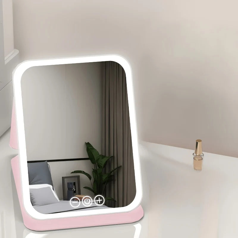 Portable pink plastic makeup mirror with touch control light, featuring a sleek design and adjustable brightness for optimal lighting during makeup application. 1