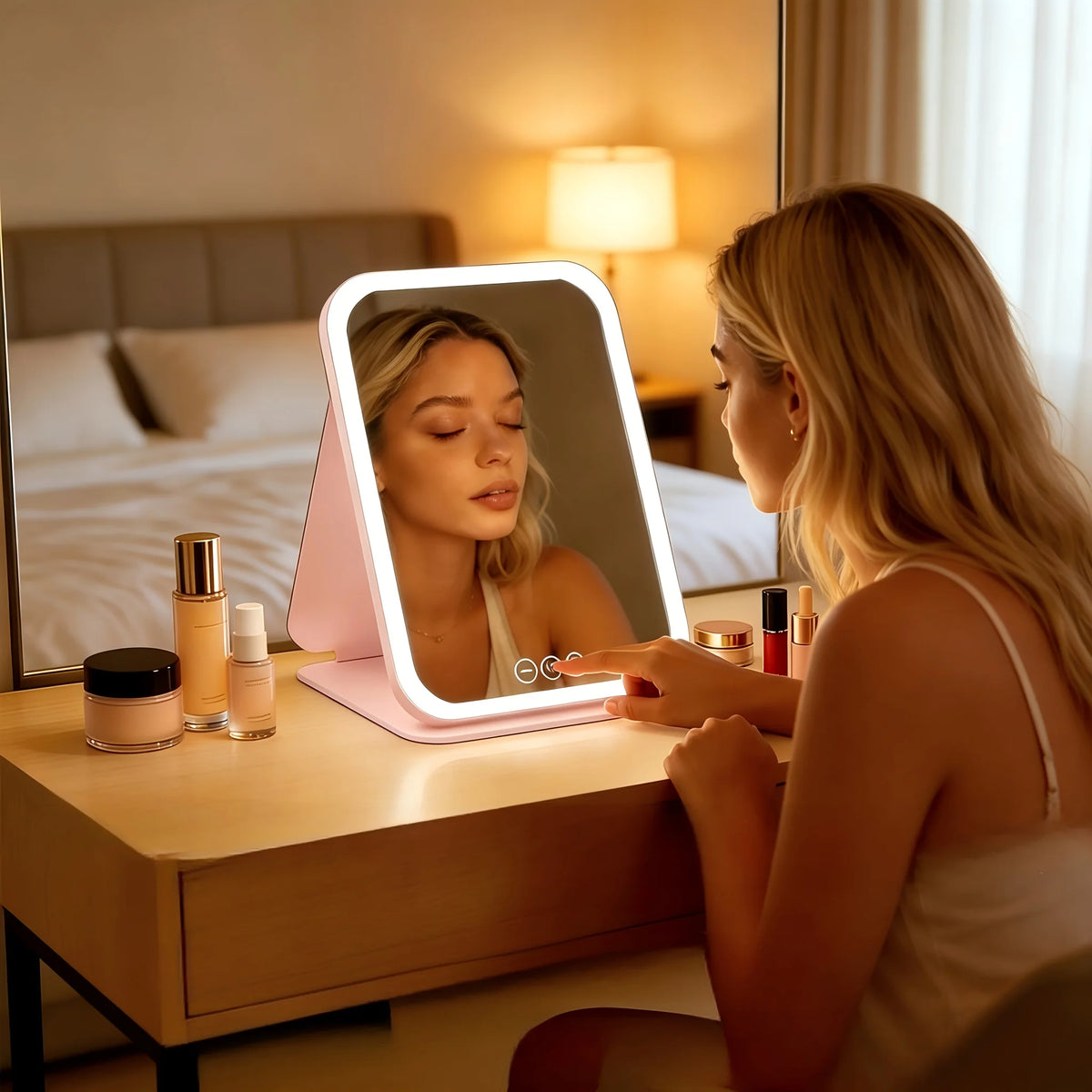 Portable pink plastic makeup mirror with touch control light, featuring a sleek design and adjustable brightness for optimal lighting during makeup application. 2