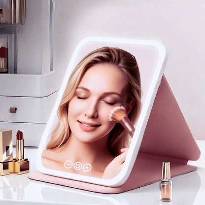 Portable pink plastic makeup mirror with touch control light, featuring a sleek design and adjustable brightness for optimal lighting during makeup application. 4
