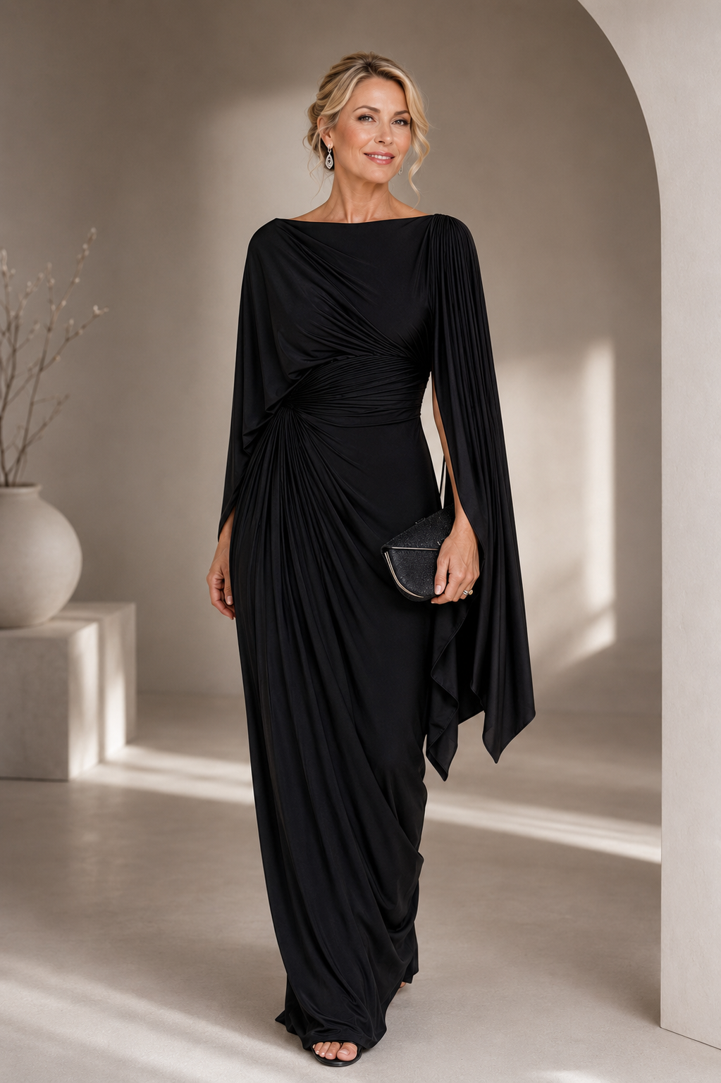 Elegant maxi dress featuring flowing cape sleeves and a ruched waist, perfect for formal occasions. 1