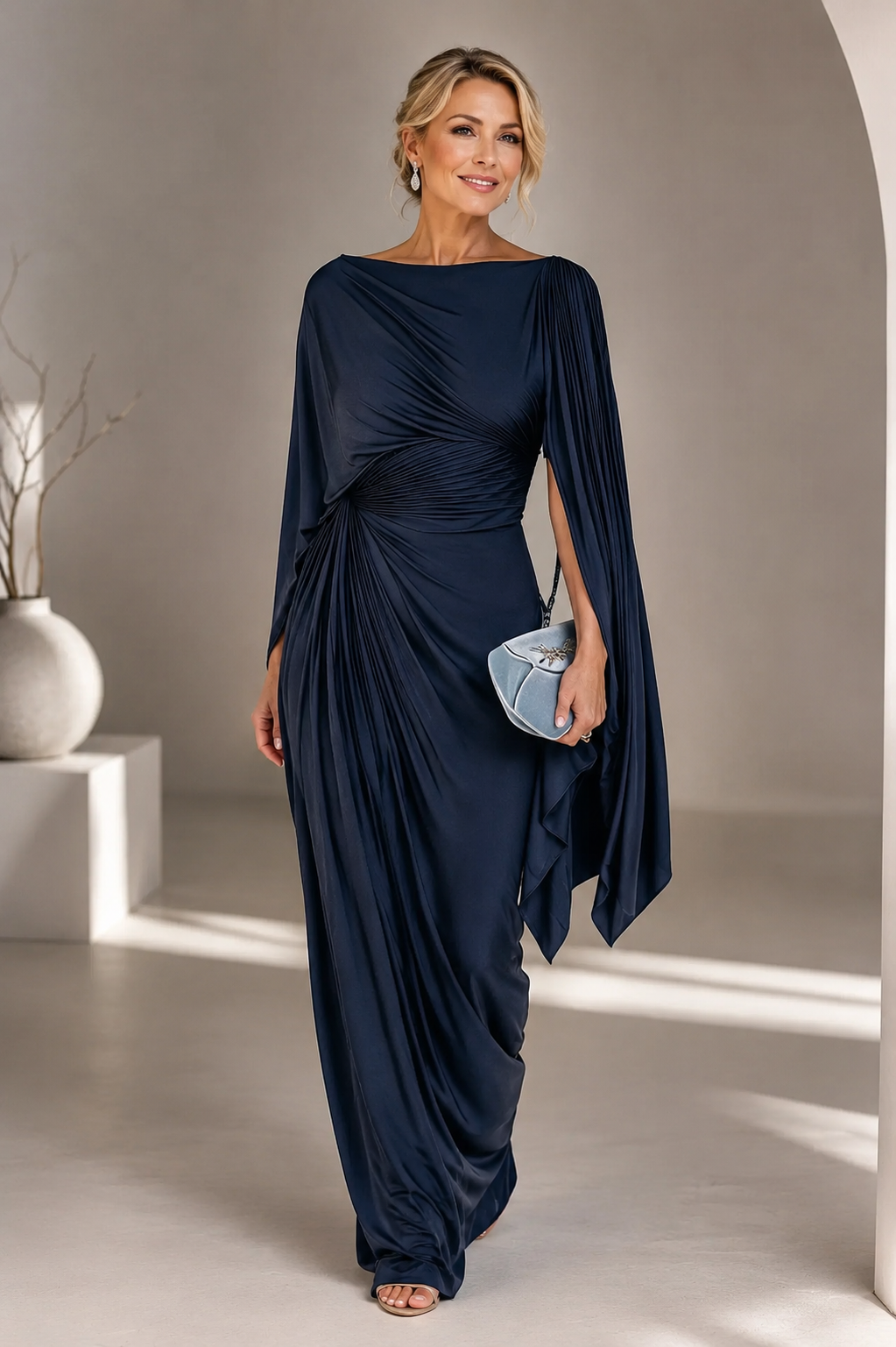 Elegant maxi dress featuring flowing cape sleeves and a ruched waist, perfect for formal occasions. 2