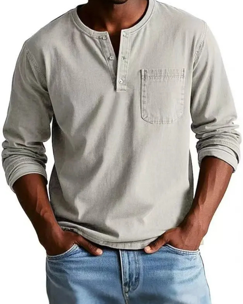 Men's denim shirt featuring a stylish henley neckline and a convenient chest pocket, perfect for casual outfits and versatile styling options. 1