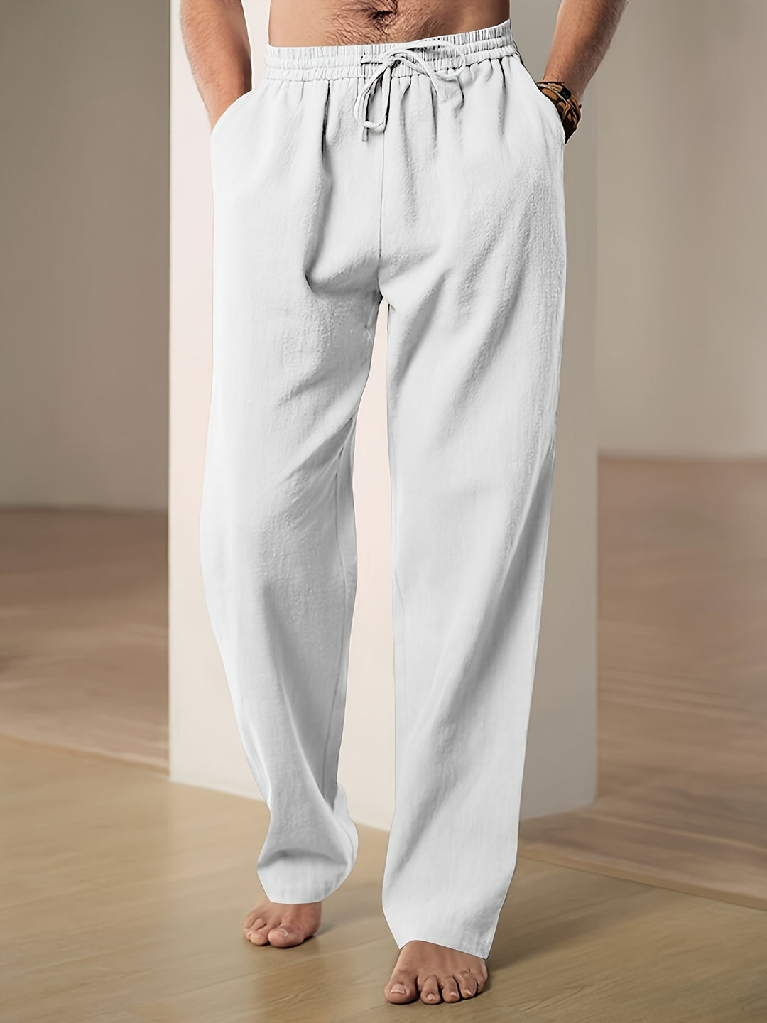 Men's linen pants featuring an elastic waist and loose fit, designed for breathability and all-day comfort, perfect for casual wear. 0