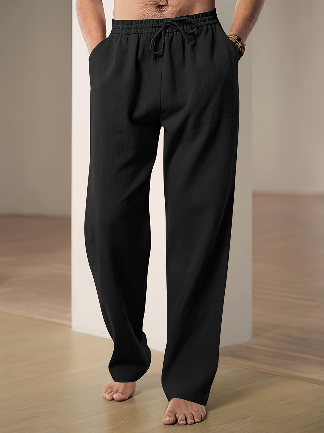 Men's linen pants featuring an elastic waist and loose fit, designed for breathability and all-day comfort, perfect for casual wear. 1