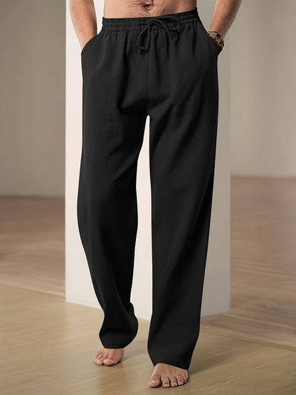 Men's linen pants featuring an elastic waist and loose fit, designed for breathability and all-day comfort, perfect for casual wear. 1