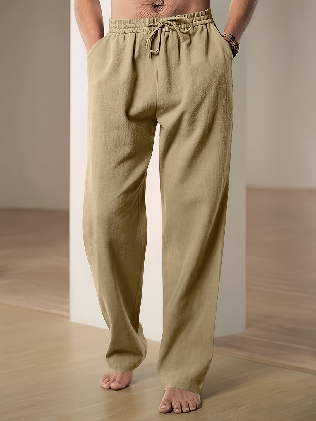Men's linen pants featuring an elastic waist and loose fit, designed for breathability and all-day comfort, perfect for casual wear. 4