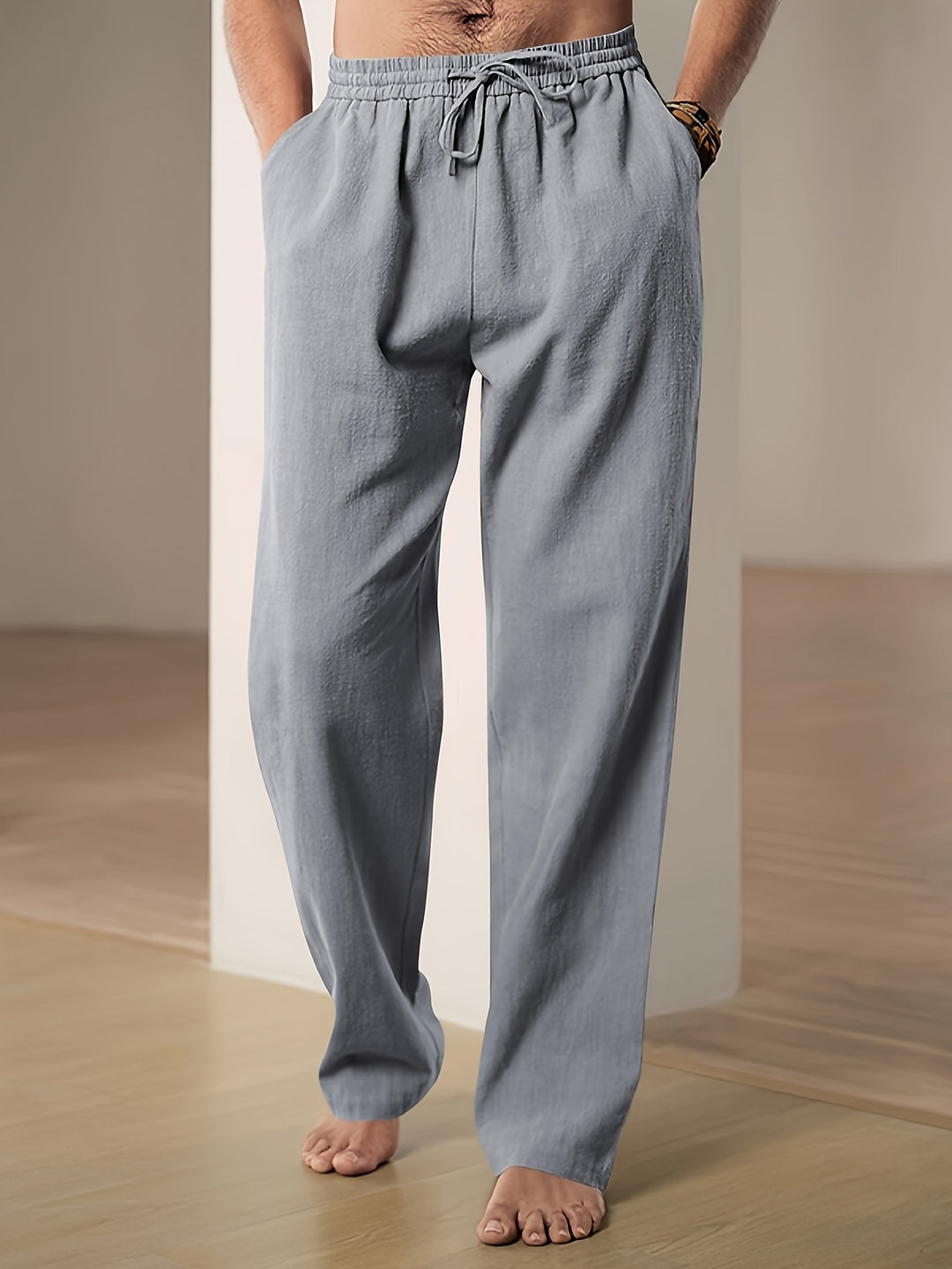 Men's linen pants featuring an elastic waist and loose fit, designed for breathability and all-day comfort, perfect for casual wear. 5