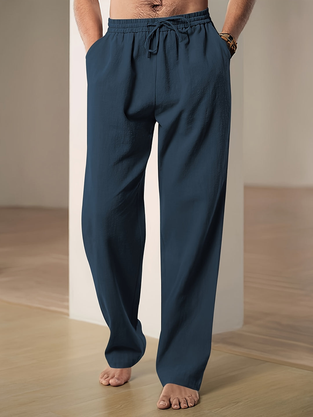 Men's linen pants featuring an elastic waist and loose fit, designed for breathability and all-day comfort, perfect for casual wear. 6