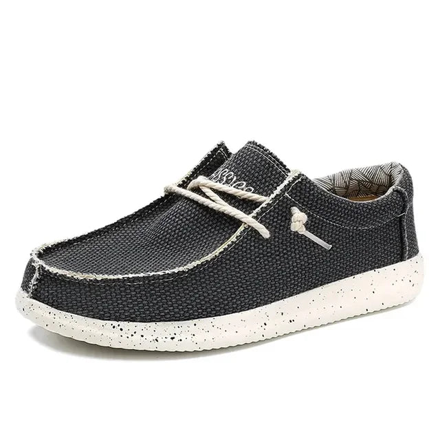 Men's black loafers featuring ergonomic support and a convenient slip-on design, perfect for all-day comfort and style. 2