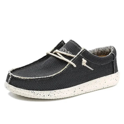 Men's black loafers featuring ergonomic support and a convenient slip-on design, perfect for all-day comfort and style. 2