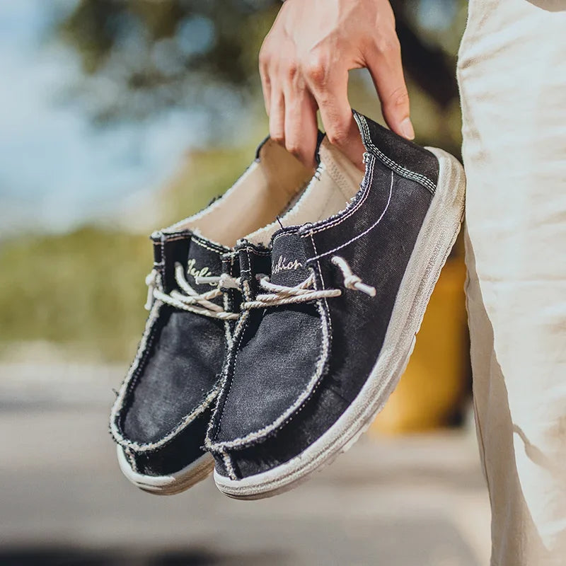 Men's black loafers featuring ergonomic support and a convenient slip-on design, perfect for all-day comfort and style. 4