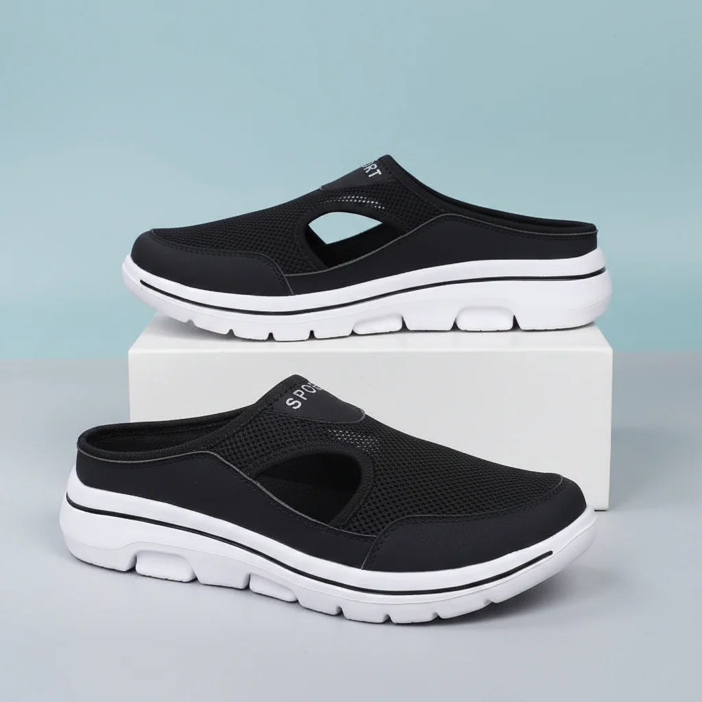 Men's orthopedic slip-on slippers featuring a breathable mesh upper, designed for wide fit comfort, perfect for both indoor and outdoor wear. 0